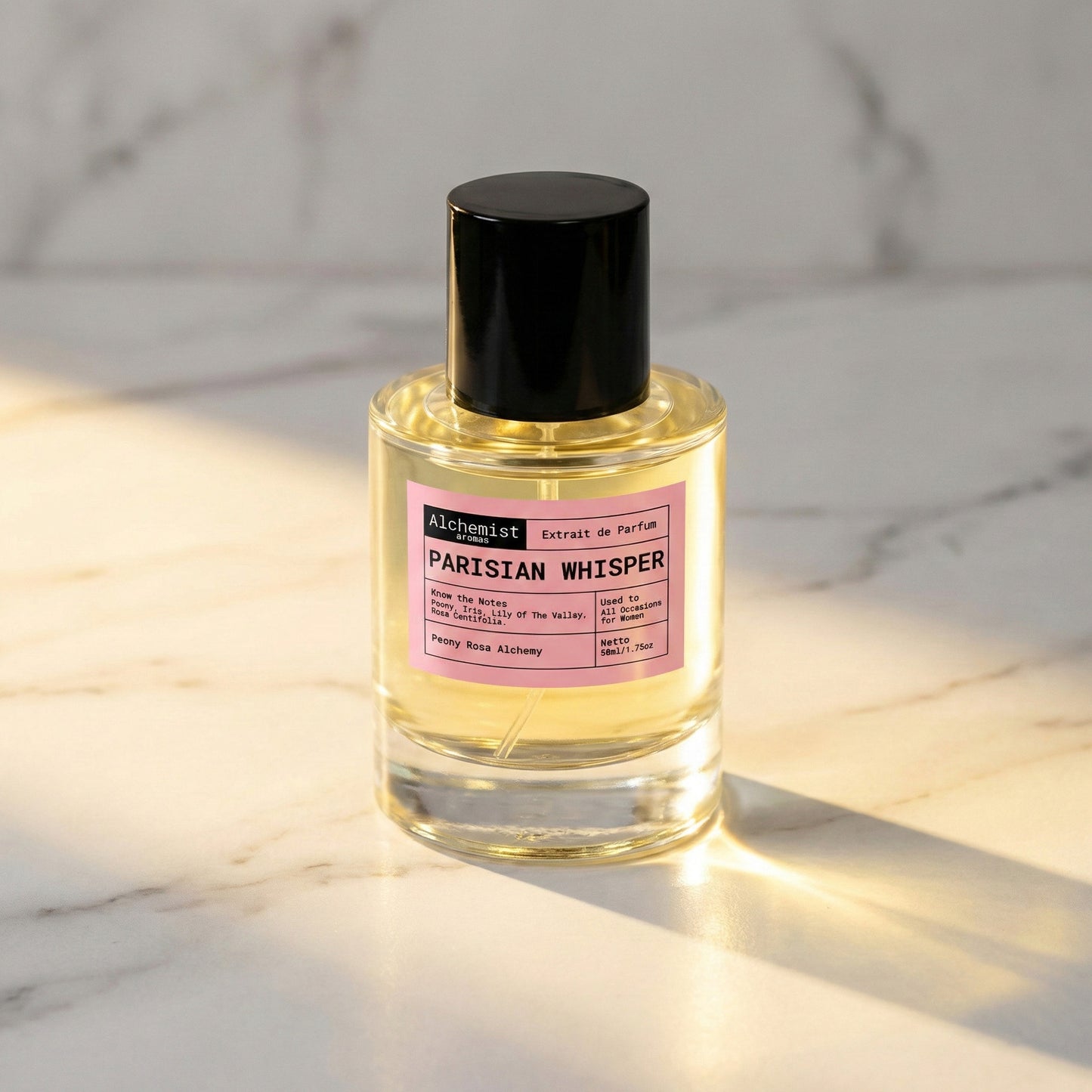 Alchemist Aromas Parisian Whisper Extrait de Parfum in a glass bottle with a black cap on a marble surface