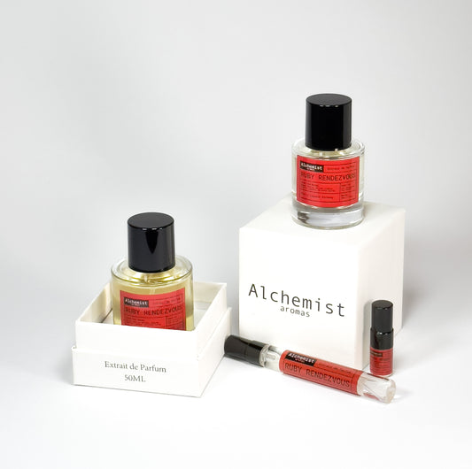 Ruby Rendezvous extrait de parfum displayed in various sizes with sleek packaging and elegant design