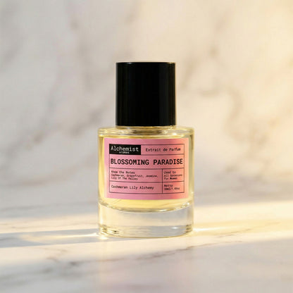Alchemist Aromas Flower Bomb Fragrance Bottle labeled Blossoming Paradise on a marble background