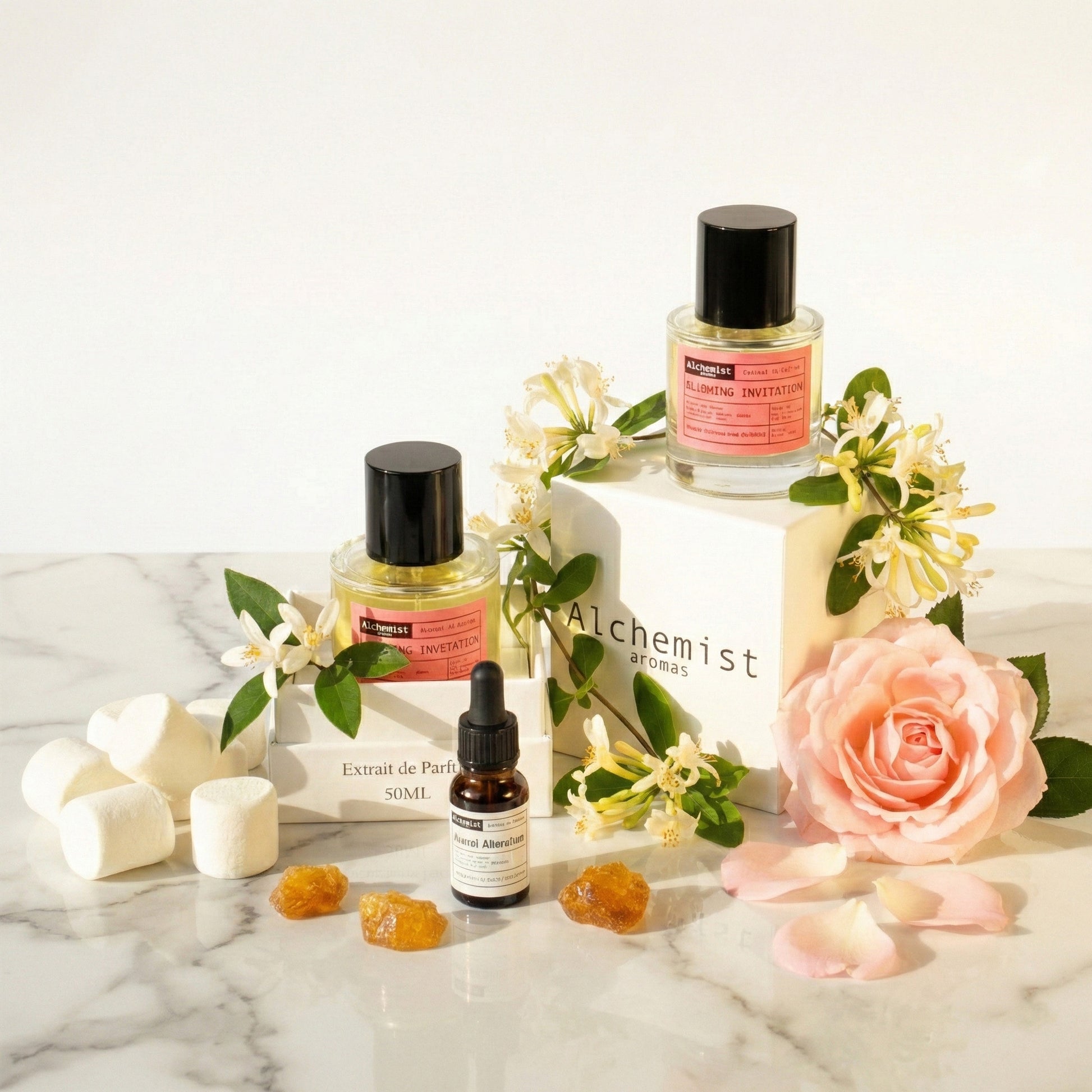 Alchemist Aromas Love don't be shy perfume and beauty products displayed with floral accents