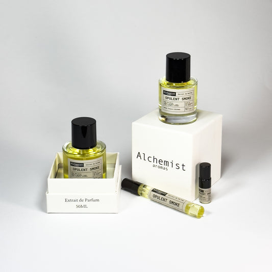 Three Opulent Smoke Extrait de Parfum bottles in various sizes displayed on a white background