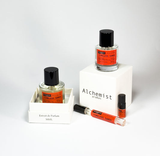 Alchemist aromas Timeless Sands extrait de parfum collection featuring various bottle sizes and designs